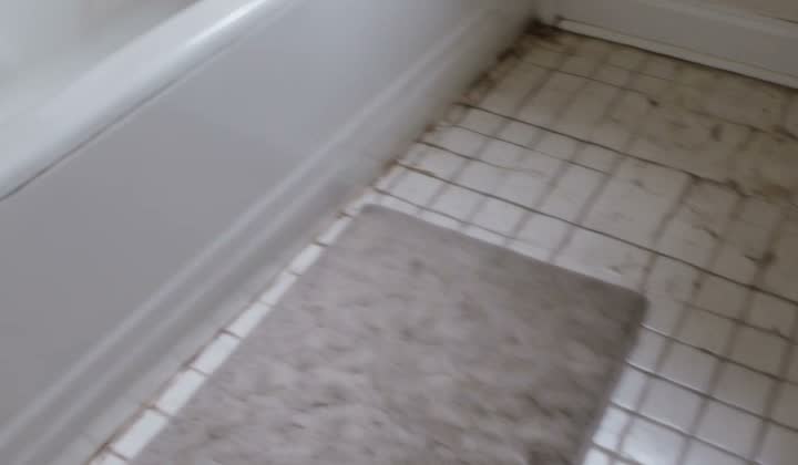 Bath mat on tile floor